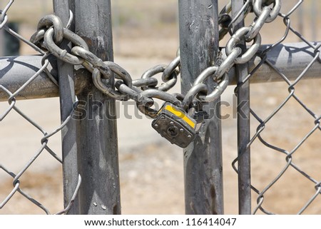 Lock on a chain link security fence.