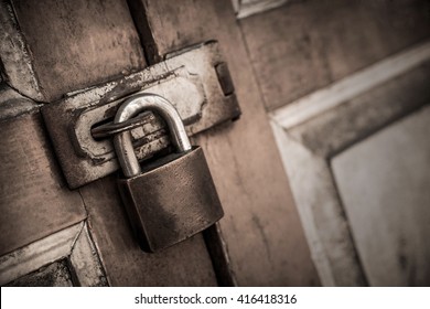 lock on the door of an old farmhouse . true village style.