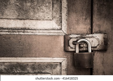 lock on the door of an old farmhouse