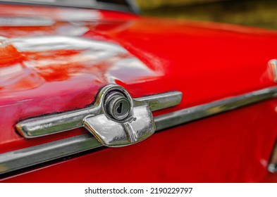 Lock on trunk of red car. Keyhole close-up of Zhiguli car.