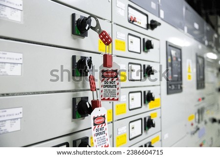 Lock out and Tag out , Lockout station, machine  specific lockout devices and lockout point. Electrical switchgear, Industrial electrical switch panel at substation in industrial zone at power plant