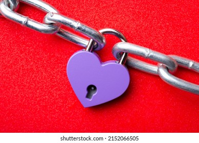 Lock In Shape Of Heart Holding Two Pieces Of Chain. Love Holding Two People Together Concept