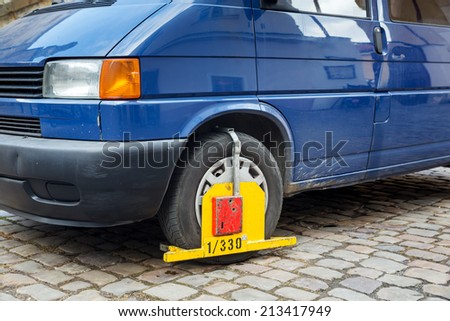 Lock wheel of illegally parked car on the street