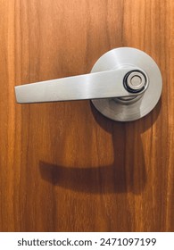 Lockable door handle on wooden door