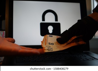 Locked Computer Ransomware With Hands Holding Money