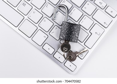 Locked computer safe from virus or malware attack. Laptop computer being protected from online cyber crime and hacking. Computer security concept with a padlock on a keyboard. protection various risks - Powered by Shutterstock - Get 15% off with code: PIKWIZARD15