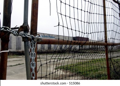 Locked Fence Outside Old Factory