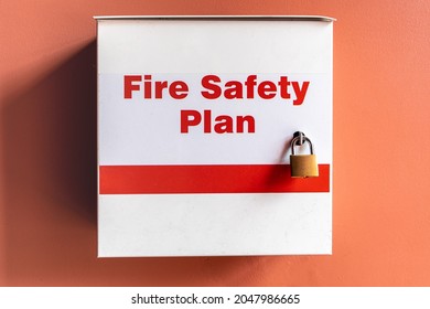 A Locked Fire Safety Plan Box On A Red Wall For Information For Fire Fighters In A Public Building