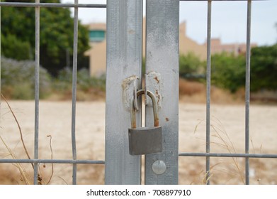 Locked Gate with padlock close up 