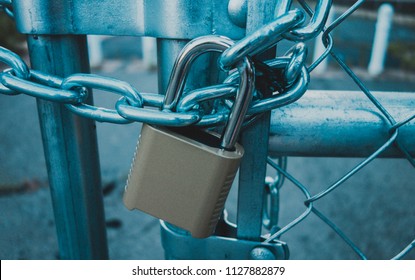 Locked Gate/Boarder Tethered by metal chain   padlock  Toned photo  Closed borders immigration concept  