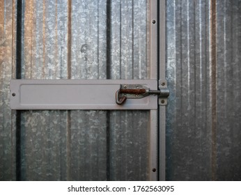 Locked Metal Storage Shed Door.