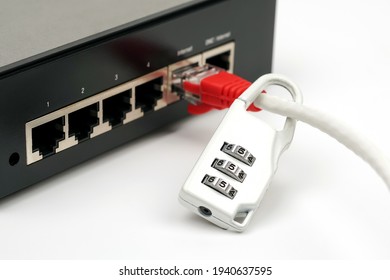 A locked padlock and network cable with modem on white background. Concept of computer network security and data protection.                  