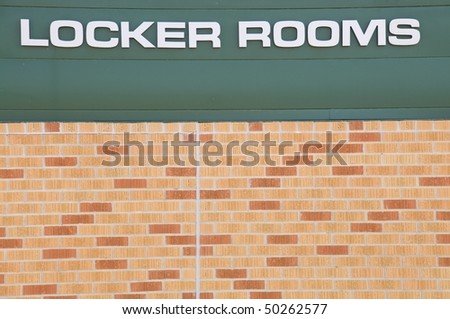 Locker Rooms sign at a football field