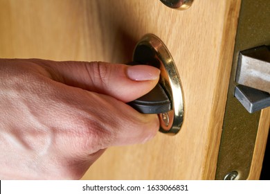 Locking Up Or Unlocking Door With Key In Hand