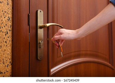 Locking Up Or Unlocking Door With Key In Hand