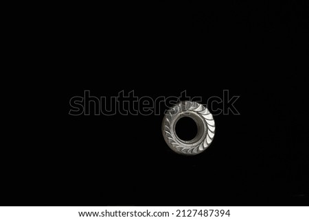 locknut in side lighting on a black background