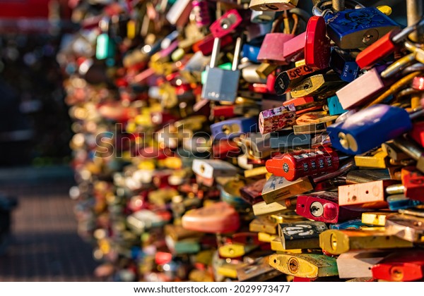 Locks attached to a bridge as a sign of love -\
COLOGNE, GERMANY - JUNE 25,\
2021
