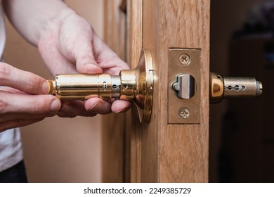 locksmith carpenter fix knob on wooden door by screwdriver for home service reparation