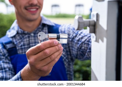 Locksmith Lock Door Repair. Worker Changing And Cylinder - Shutterstock ID 2001344684
