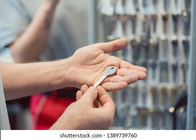 Locksmith Showing Key Blanks In His Shop