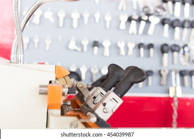 Locksmith Tools On Blur Keys Stand Background