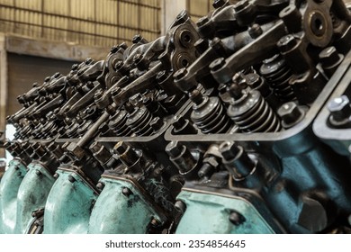Locomotive diesel engine spare parts in a maintenance workshop Cylinder blocks, pistons, crankshafts, valves, exhaust pipes, etc. - Shutterstock ID 2354854645
