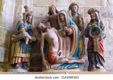 Locronan, France - August 10 2017: Penity Chapel: Descent From The Cross And Mourning (Sculpture XVI Century) Chiseled Masterpiece In Granite, Tomb Of Saint Ronan.