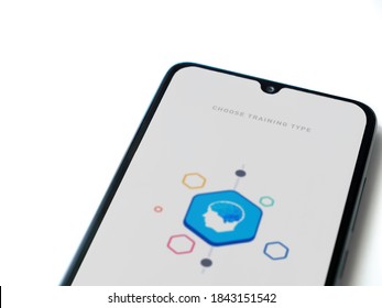 Lod, Israel - July 8, 2020: Elevate - Brain Training Games App Launch Screen With Logo On The Display Of A Black Mobile Smartphone Isolated On White Background. Top View Flat Lay With Copy Space.