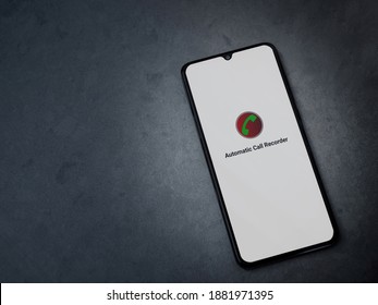 Lod, Israel - July 8, 2020: Automatic Call Recorder App Launch Screen With Logo On The Display Of A Black Mobile Smartphone On Dark Marble Stone Background. Top View Flat Lay With Copy Space.