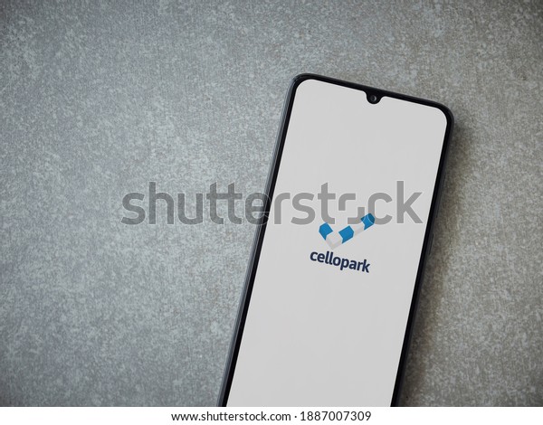 Lod, Israel - July 8,\
2020: Cellopark app launch screen with logo on the display of a\
black mobile smartphone on ceramic stone background. Top view flat\
lay with copy space.