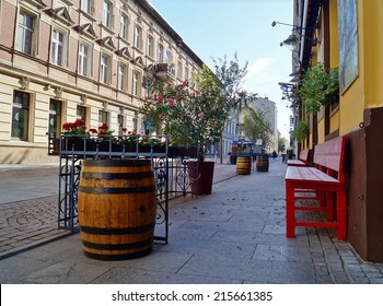 LODZ, POLAND - AUGUST 19, 2014: Sunday Afternoon On Piotrkowska Street, Woonerf - Alley In The Shade