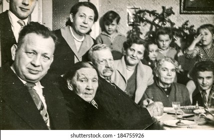 LODZ, POLAND, CIRCA 1950's: Vintage Photo Of People During A Family Dinner