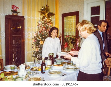 LODZ, POLAND, CIRCA 1990: Vintage Photo Of Family During A Christmas Party