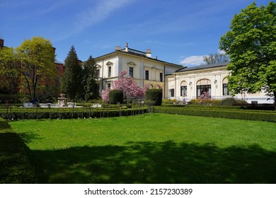 LODZ,POLAND, MAY 2022; Beatiful garden. Museum - a neo-Renaissance palace - Villa Edward Herbst - carriage house