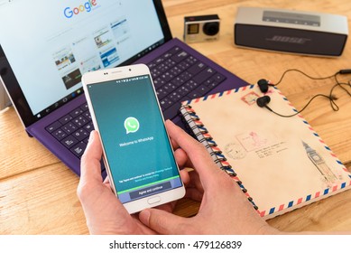 LOEI, THAILAND - SEP 6, 2016: Man holds a white Samsung smartphone that displays WhatsApp on the screen. Whatsapp is a proprietary, cross-platform, encrypted instant messaging client for smartphones.