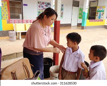 Loei ,Thailand-August ,28 : Nurse vaccinates children to protect them against measles at elementary school in Loei,Thailand on August 28, 2015