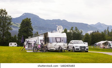 Lofer, Austria - May 28, 2018: Autocampers Are On Campground Parking In The Alpine Mountains.