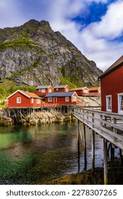 Lofoten summer landscape. Lofoten is an archipelago in Nordland county, Norway. It is known for distinctive scenery with dramatic mountains and peaks