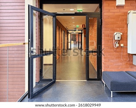 Loft empty office corridor with open door, horizontal building background