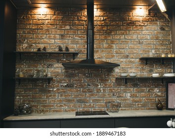 loft kitchen interior with brick wall. stylish design of a modern apartment