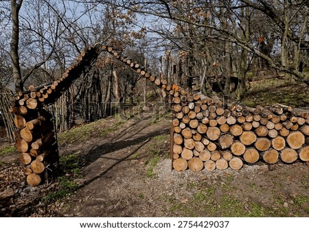 log arch, and while  it’s defying gravity, it relies on some very specific physics and likely bit of hidden support to keep from collapsing on someone's head. ​If you’re interested in how this works or how to build something similar