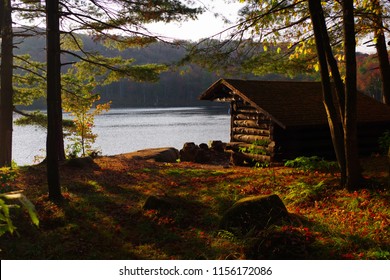 Log Cabin Lean-To Campsite in the Adirondack Mountains of Upstate New York in Autumn. Fall Leaf foliage approaching peak levels. Vibrant reds, yellows, oranges, and greens.
