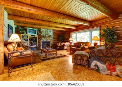 Log Cabin Living Room Interior With Wood Ceiling.