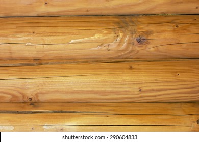 A Log Cabin Wall Built From Logs As A Background