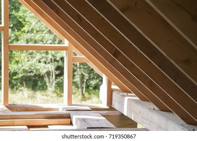 Log Cabin Wall Frame And The Rafters On Roof Construction