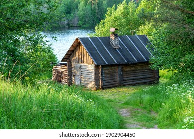 Log Cabin, wooden hut finnish sauna, green forest meadow landscape