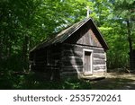 A log chapel built in a sparsely populated area in the forest in the late 18th century in Canada. It was used for religious services and other gatherings 