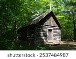 A log chapel built in a sparsely populated area in the forest in the late 18th century in Canada. It was used for religious services and other gatherings 