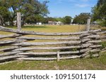 log fence constructed of wood and wire