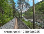 log flume of the historic restored wooden raft channel or timber slide of Tommerrenna in southern Norway near Vennesla